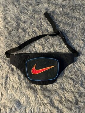 Upcycled Black Waist Pack with Red-to-Orange Swoosh and Blue Trim